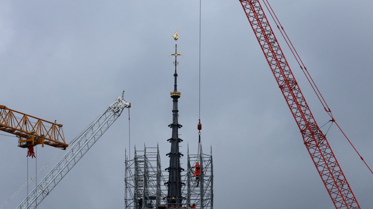 Notre Dame reveals new spire and golden rooster as scaffolding removed