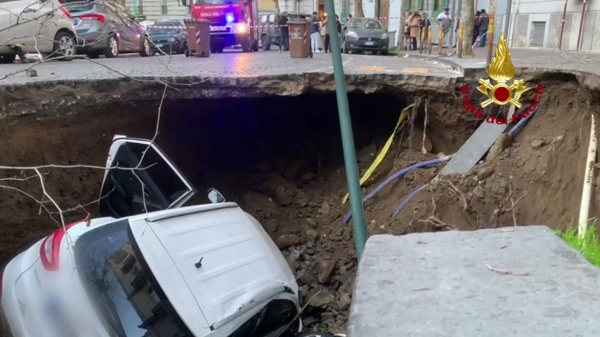 Huge sinkhole in Naples swallows two cars  
