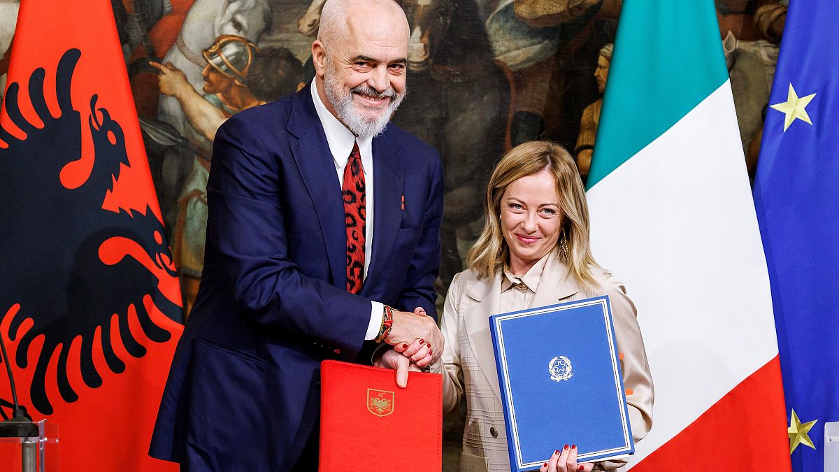 Albanian parliament approves controversial deal to hold migrants for Italy