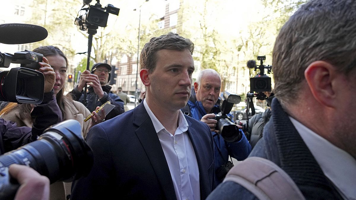 Two men charged in UK with spying for China granted bail after London court appearance 