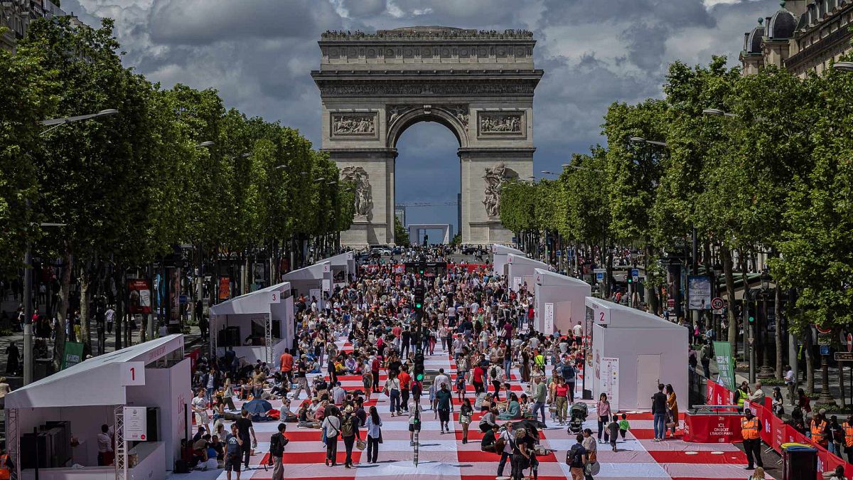 Paris' famous Champs-&Eacute;lys&eacute;es transformed into a massive free picnic with treats from famous chefs 