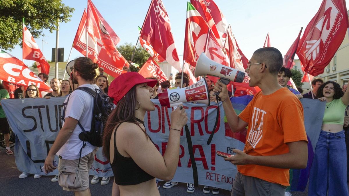 Extinction Rebellion protesters chain themselves up outside G7 summit 