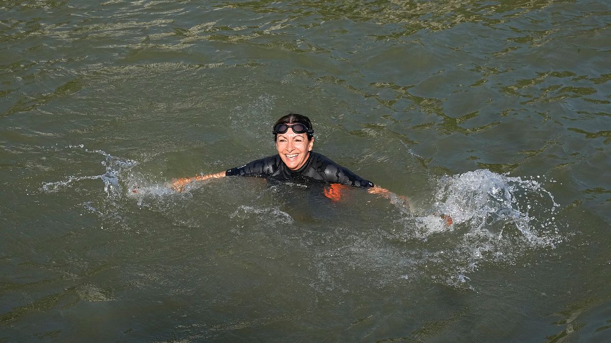 Paris mayor takes dip in the Seine to showcase its cleanliness as Olympic events loom 