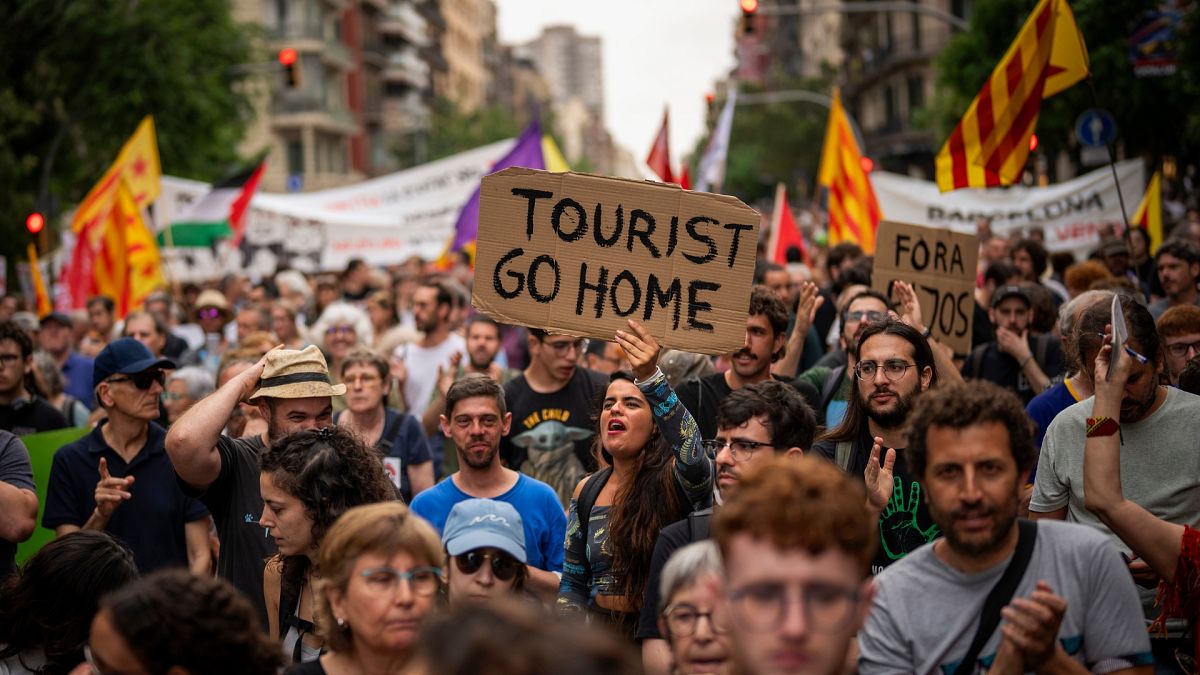 Barcelona protesters spray visitors with water: Why has Europe fallen out of love with tourism? 