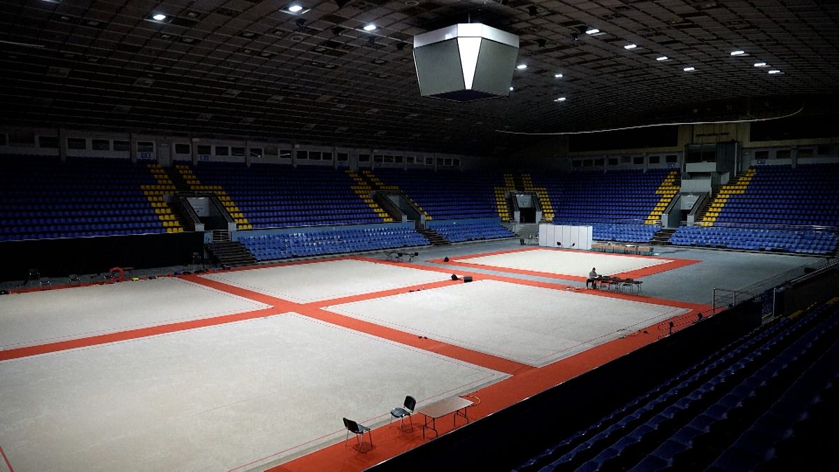 War in Ukraine threatens its Olympic future &mdash; but a young amputee gymnast stays hopeful 